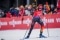 The image shows a biathlete.