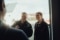 The image shows service technician Andreas Schneider with a female colleague.