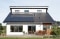 The image shows a house with photovoltaics.