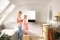 The image shows family in the bathroom with Vitodens.