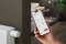 The image shows the ViCare app open on the screen of a smartphone in a person's hand