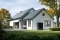 The image shows a house with solar panels on the roof, a garden, and a Vitocal heat pump mounted on the side of the house.