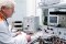 The picture shows an employee in the electrotechnical laboratory.